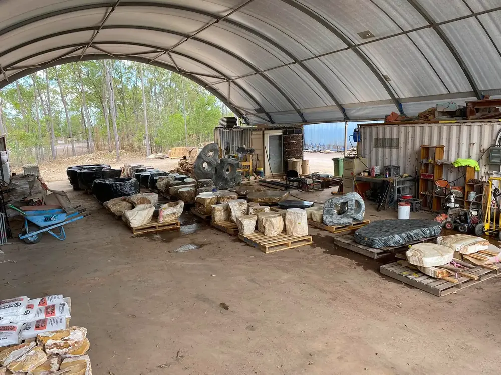 Covered Finlay's Stone work and product area with natural stone stock