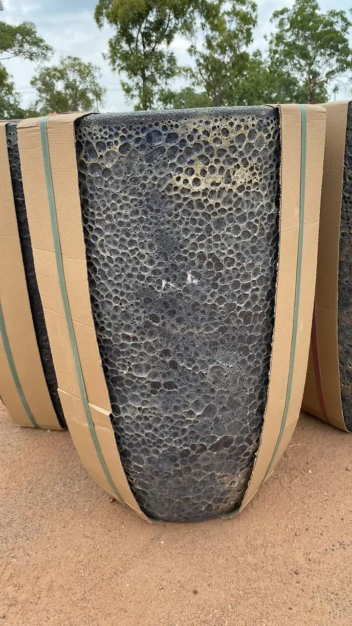 Close view of a tall textured garden pot