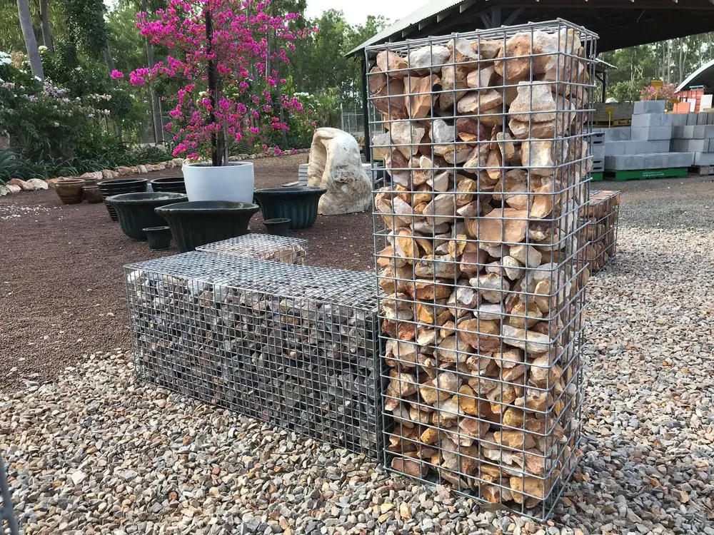 Gabion baskets filled with decorative stone in the landscape yard