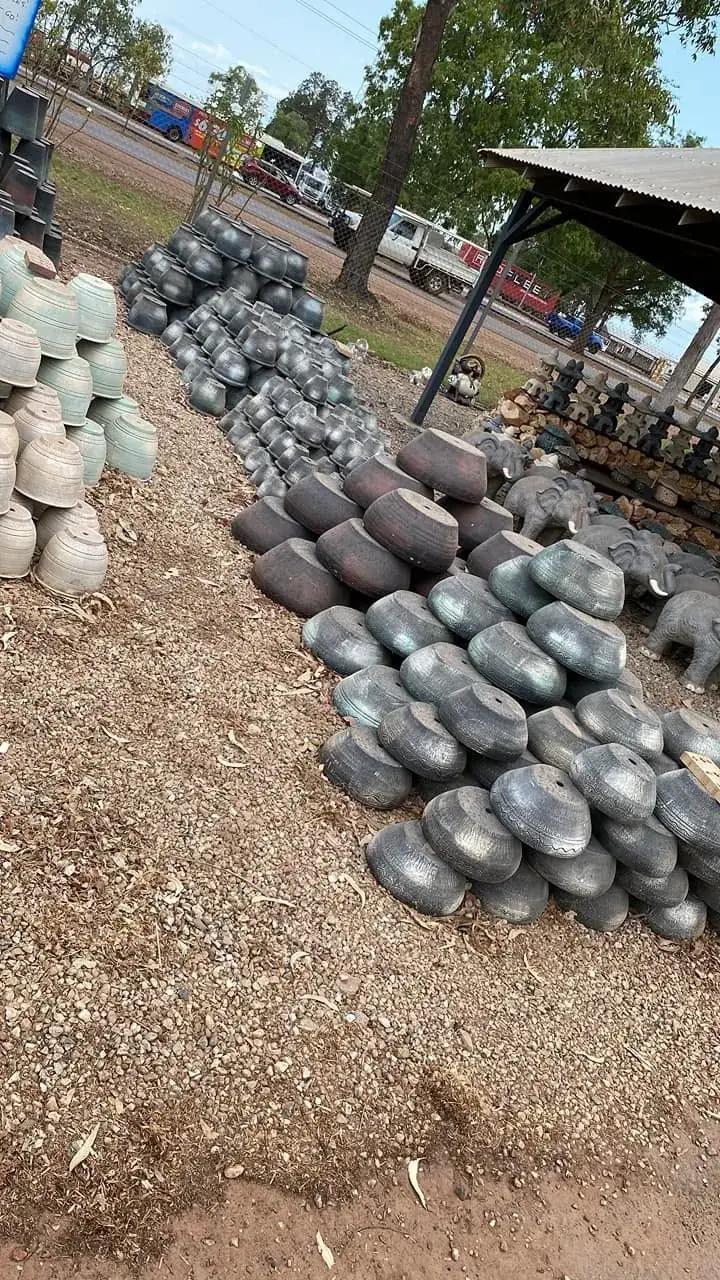 Rounded landscape stone and garden products displayed in the yard